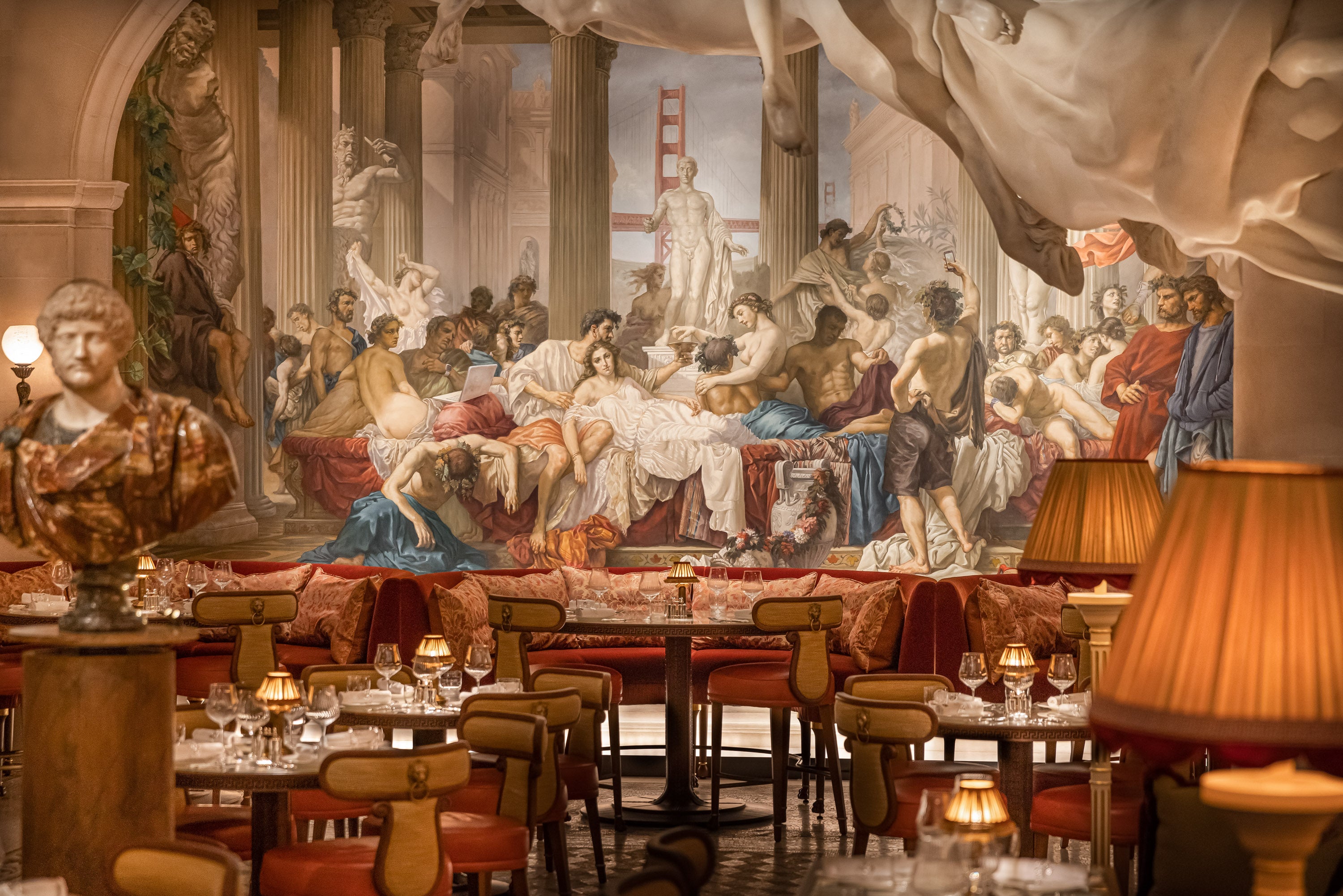 Bacchanalia Luxurious restaurant with classical art mural, plush red seating, and warm ambient lighting throughout.