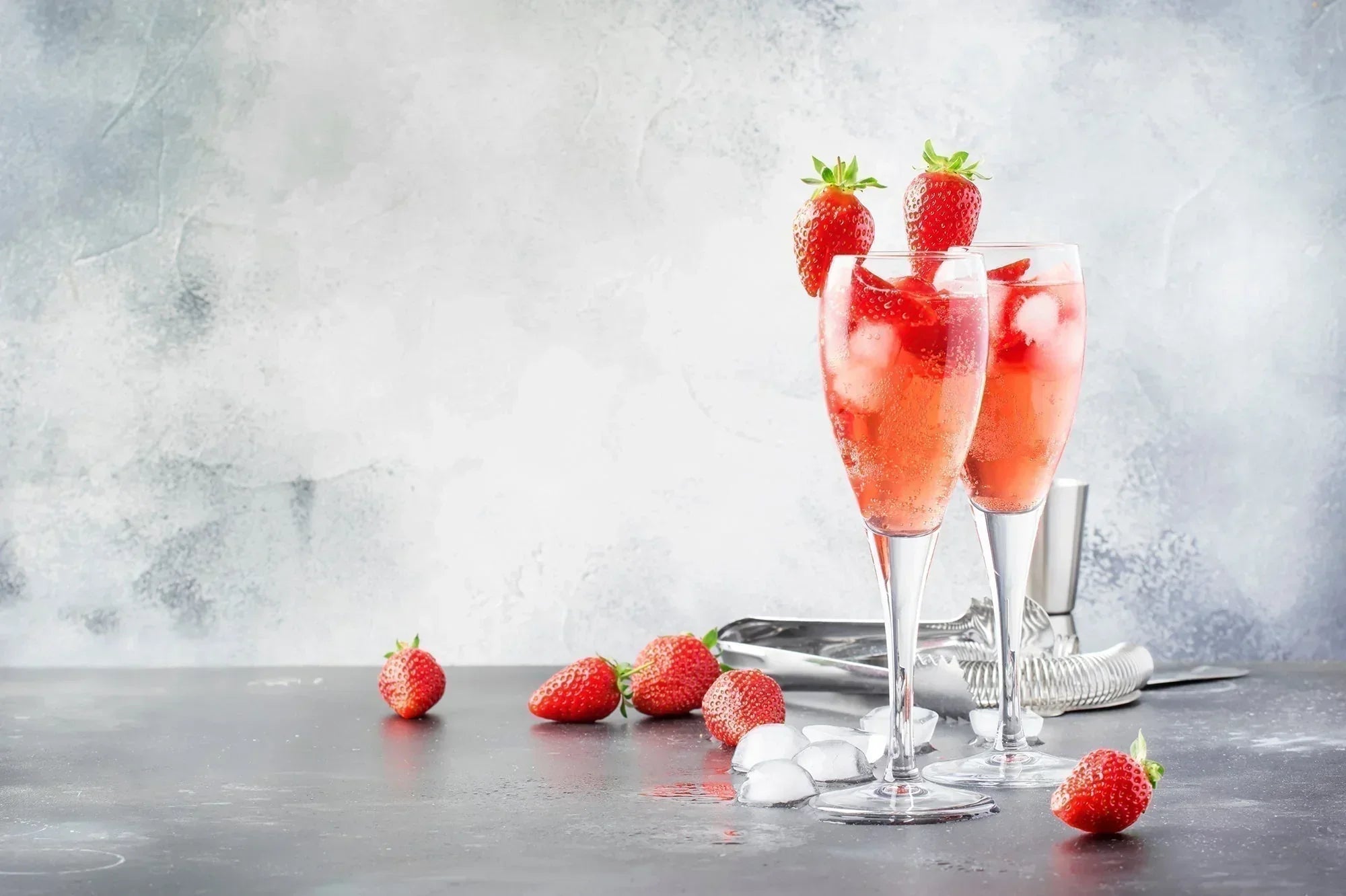strawberry champagne against grey background