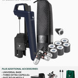 Coravin Timeless Six System limited edition kit on a white background, featuring a dark navy blue handheld device, black and silver needle components, a black zippered carrying case, several small cylindrical capsules, a small accessory piece, and a green gift bag. Text at the top reads 'LIMITED EDITION TIMELESS SIX - SYSTEM' and text at the bottom lists additional accessories.